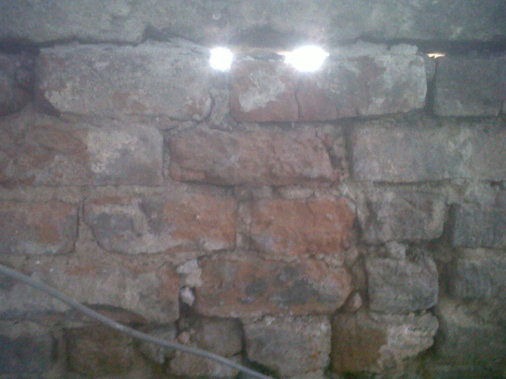 Daylight can be seen coming through some of the brickwork.