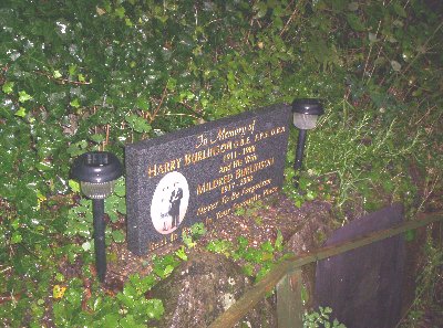 Solar lights installed beside the memorial stone.