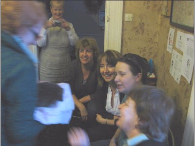 Hannah,Barbara's volunteer assistant presents the hedgehog to the audience.